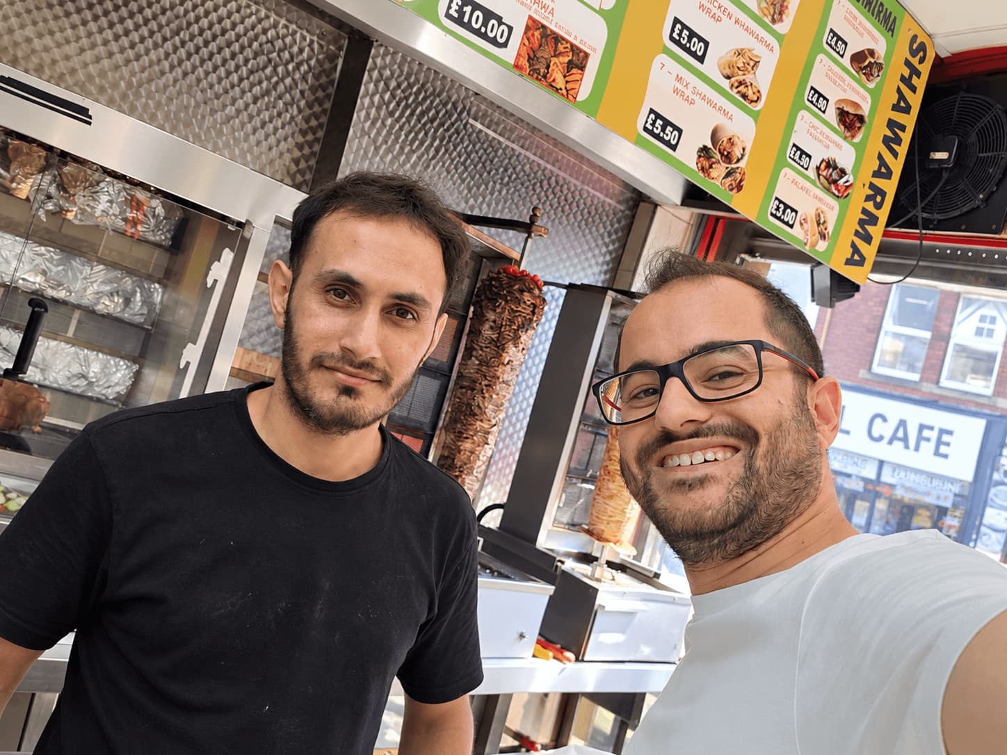 Jad El Omeiri with a Shawarma Laziz team member inside the City Road takeaway in Cardiff