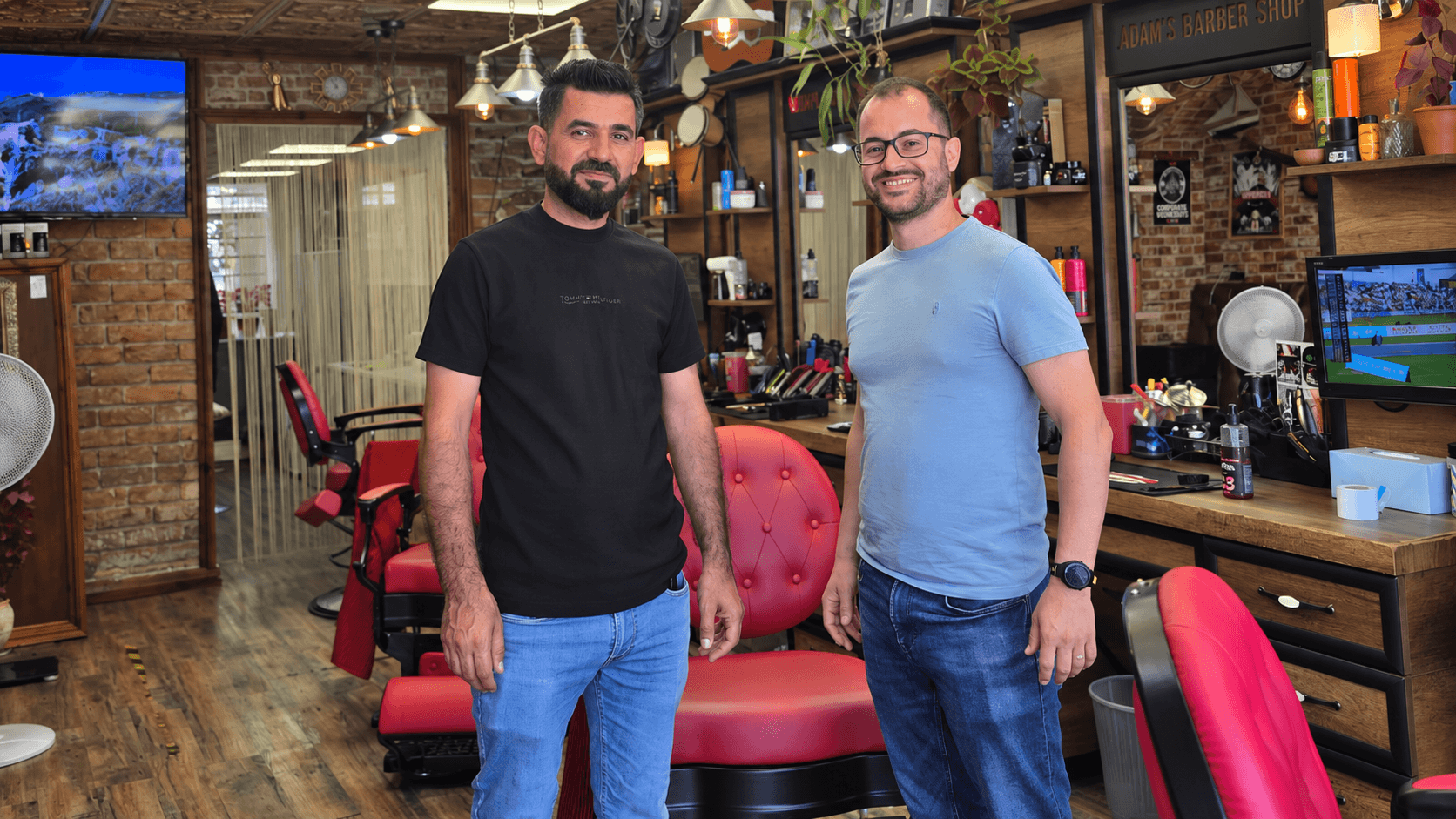 Jad El Omeiri with an Adam’s Barber Shop team member inside the Salisbury Road barber shop in Cardiff